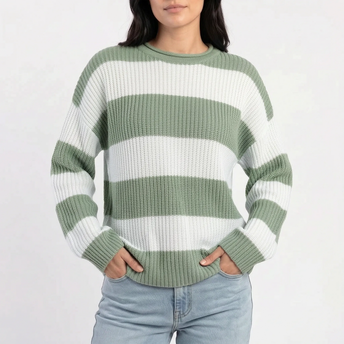 Woman wearing an oversized striped knitted jumper with a crew neck and long sleeves