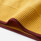 Women's knitted two-piece set with quarter-zip top, wide-leg trousers and contrast stripes