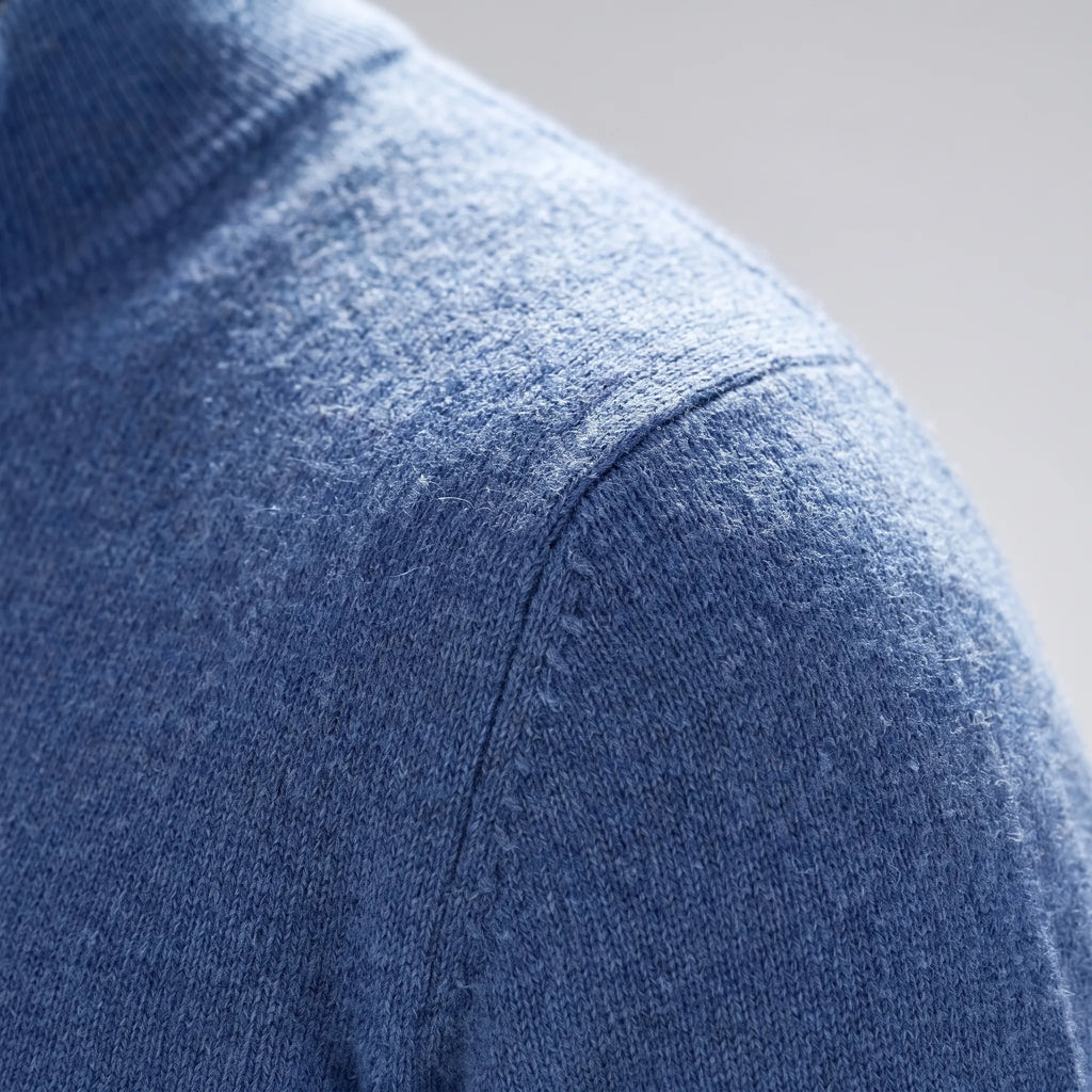 Men's blue quarter zip knit jumper with stand collar and long sleeves