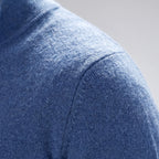 Men's blue quarter zip knit jumper with stand collar and long sleeves
