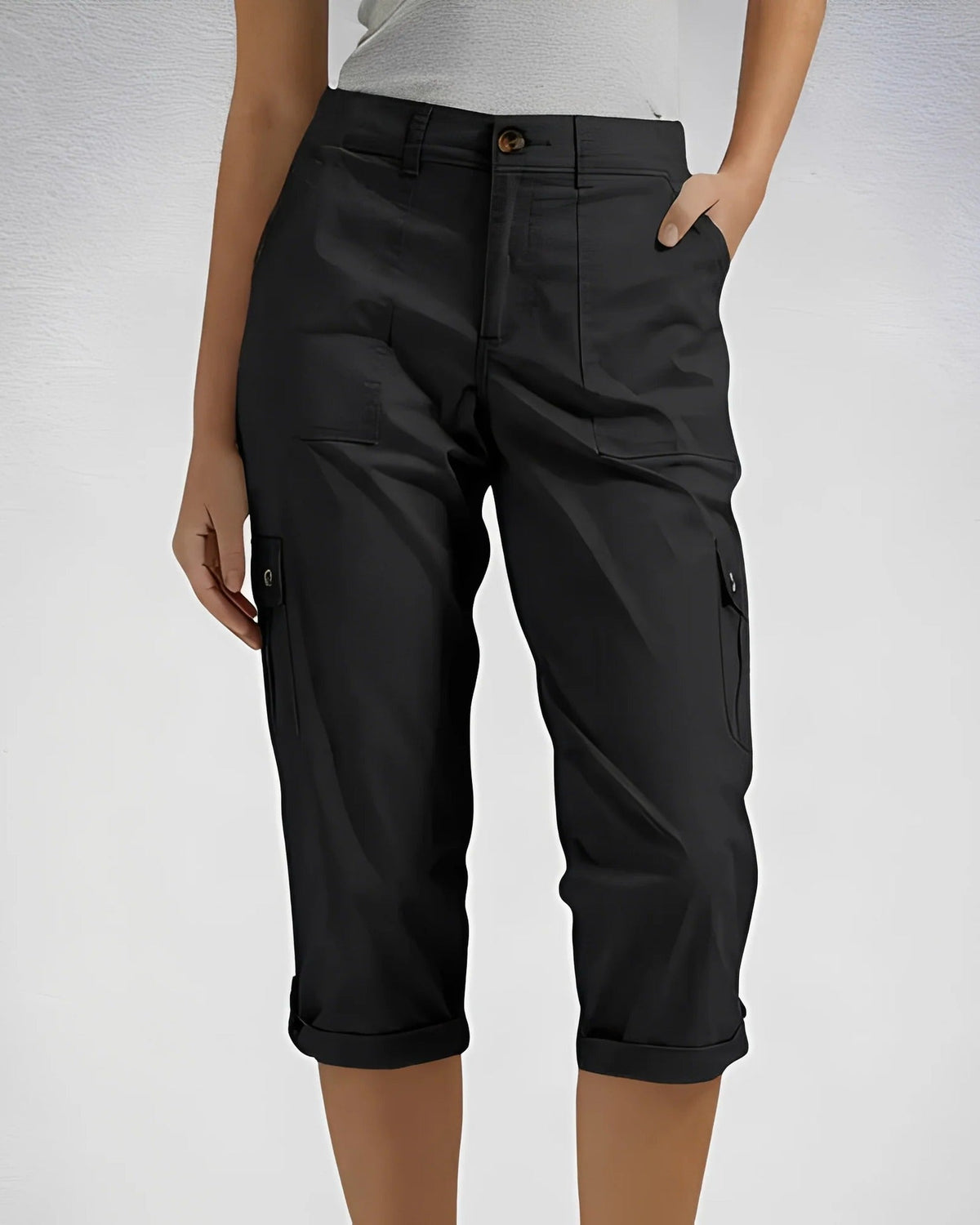 Women's cropped cargo trousers with rolled cuffs and multiple utility pockets
