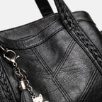Women's structured tote handbag with diamond-point stitching and top handles