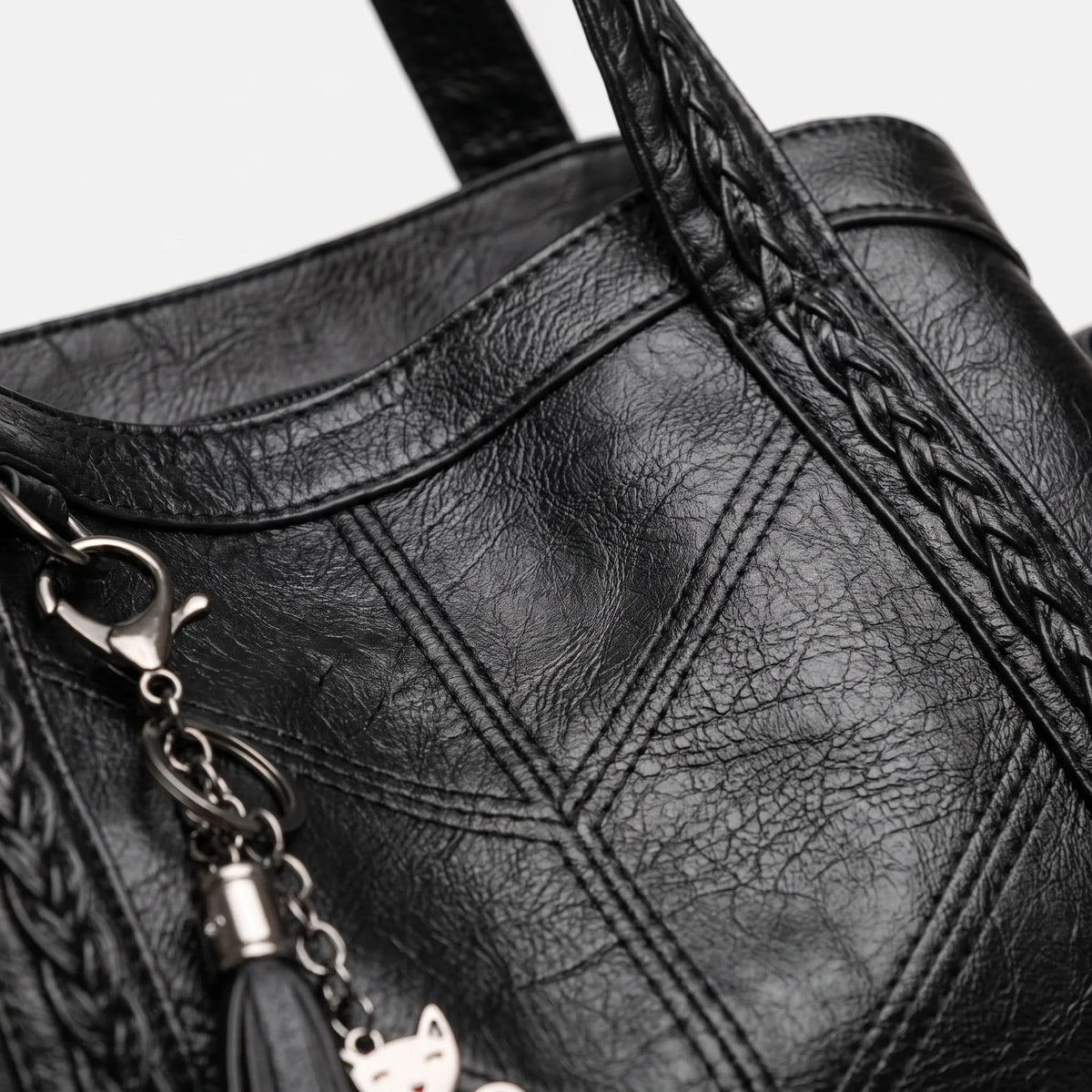 Women's structured tote handbag with diamond-point stitching and top handles