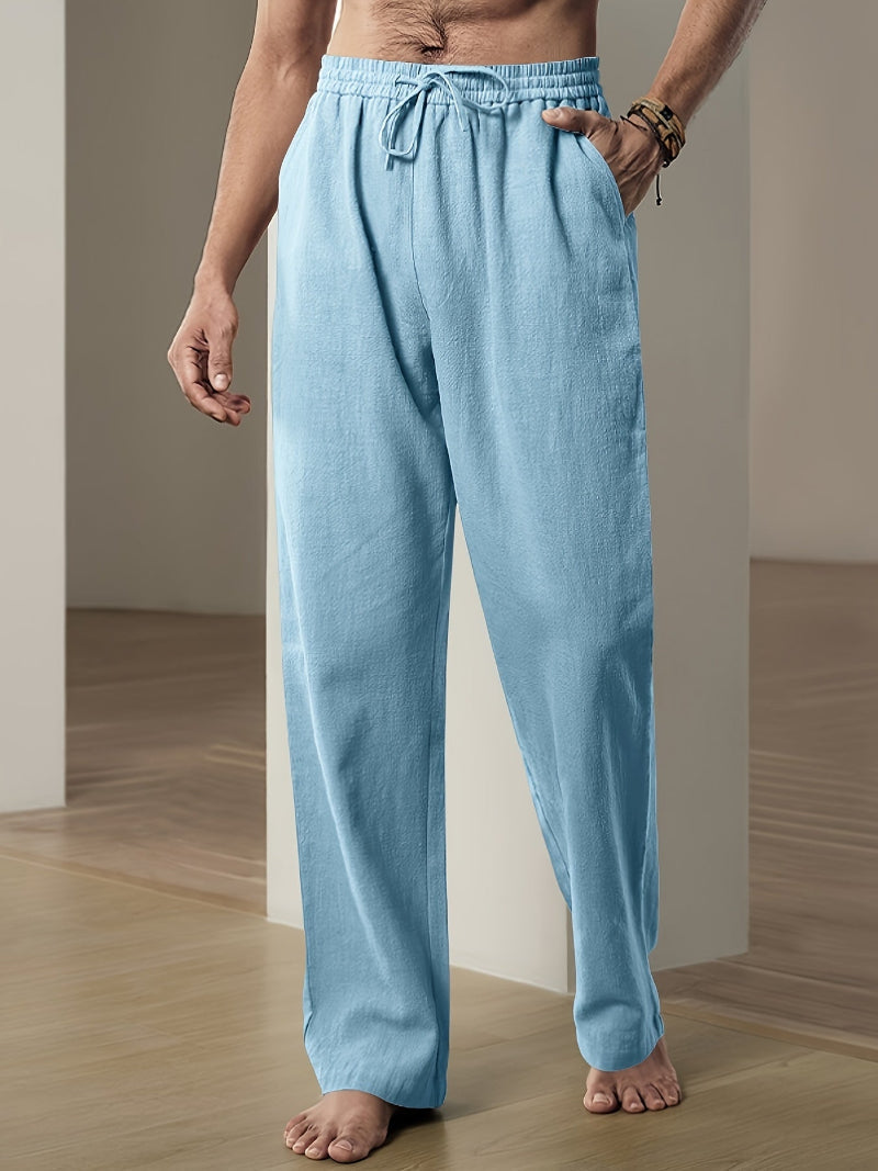 Men's plain straight-leg trousers with an elasticated drawstring waist and side pockets