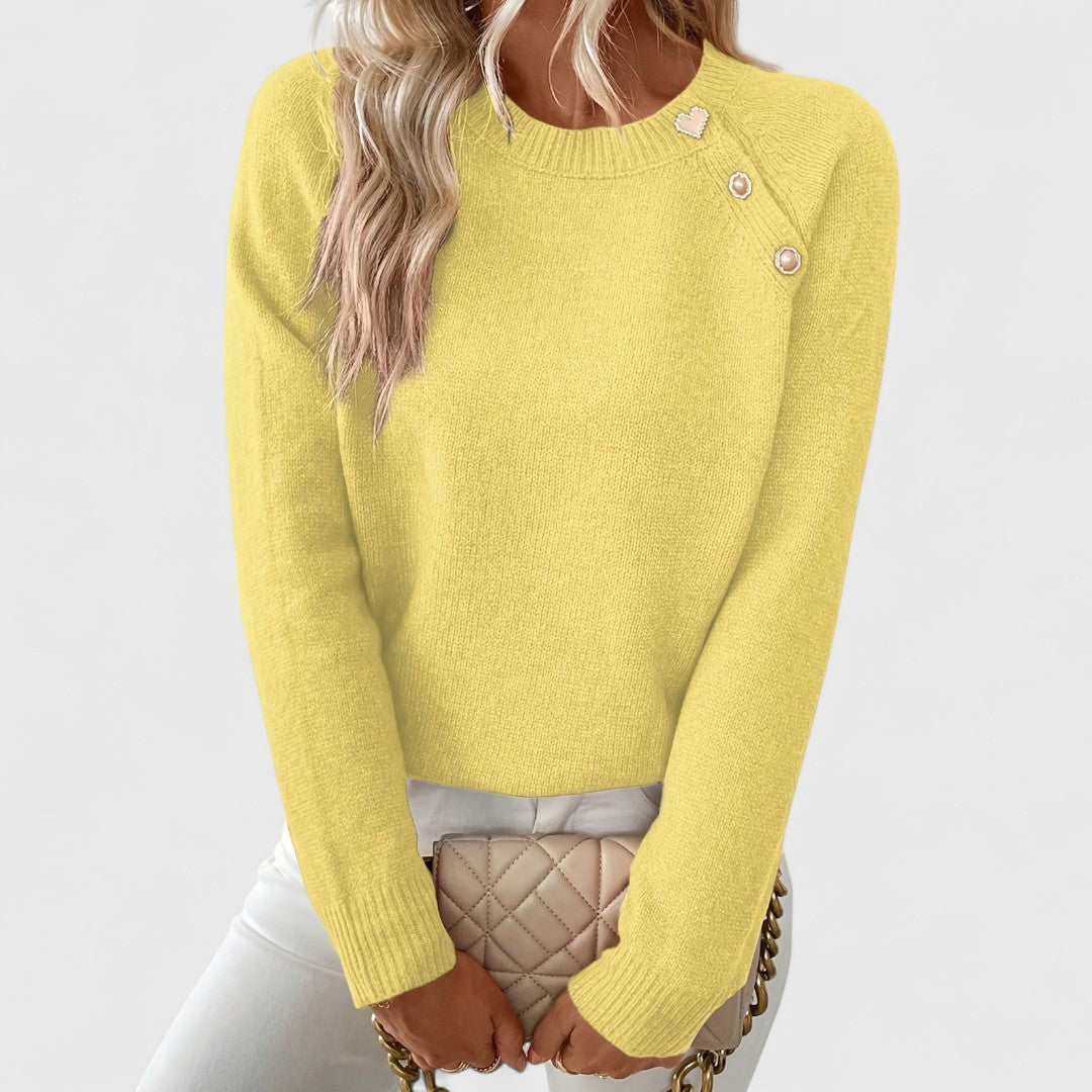 Women's crew neck knitted jumper with long sleeves and upper front button detail