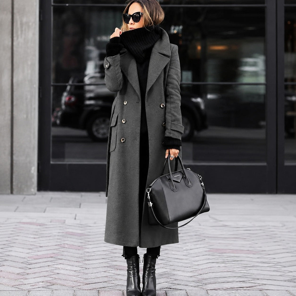 Women's long fitted double-breasted coat with notched lapels and buttoned cuffs