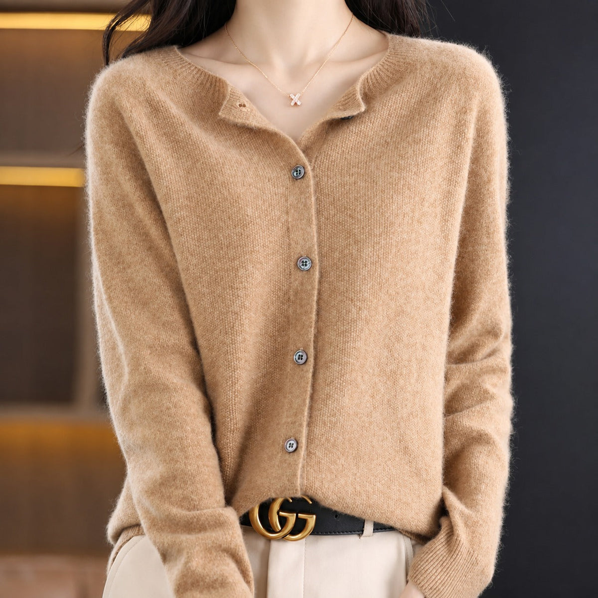 Women's plain knitted button-front cardigan with crew neckline and long sleeves