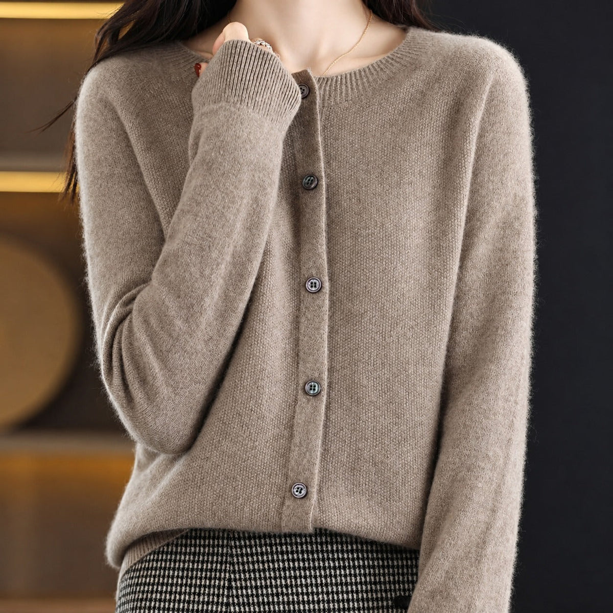 Women's plain knitted button-front cardigan with crew neckline and long sleeves