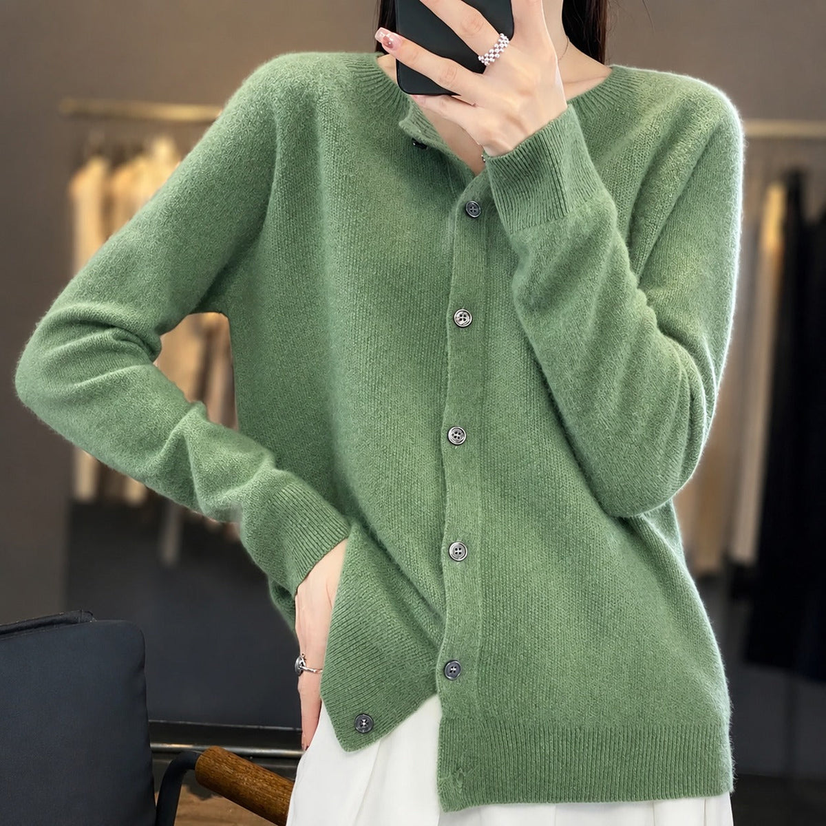 Women's plain knitted button-front cardigan with crew neckline and long sleeves