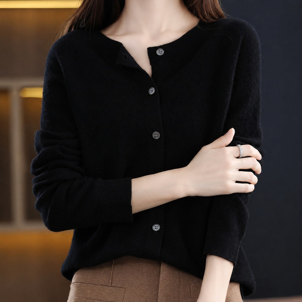 Women's plain knitted button-front cardigan with crew neckline and long sleeves