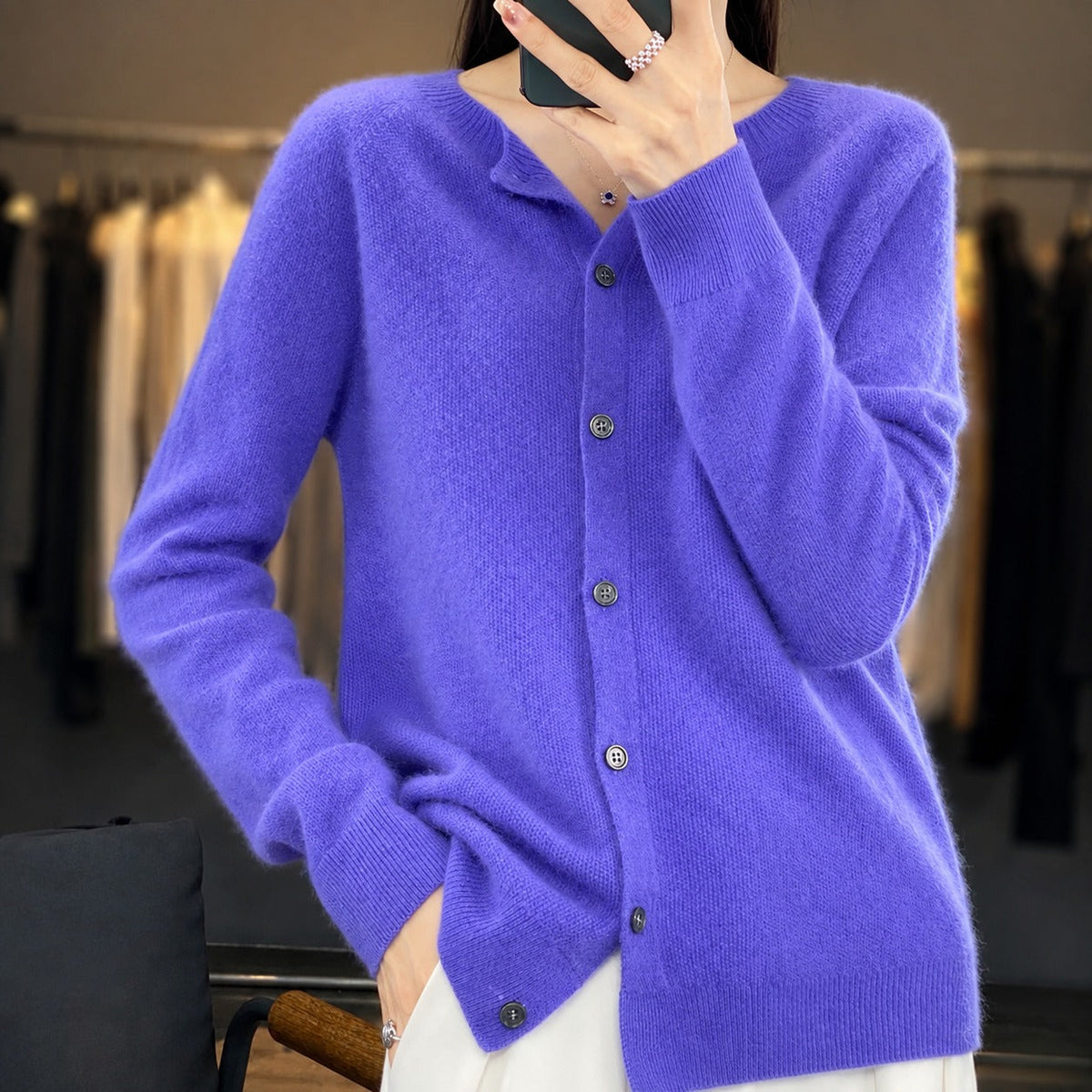 Women's plain knitted button-front cardigan with crew neckline and long sleeves