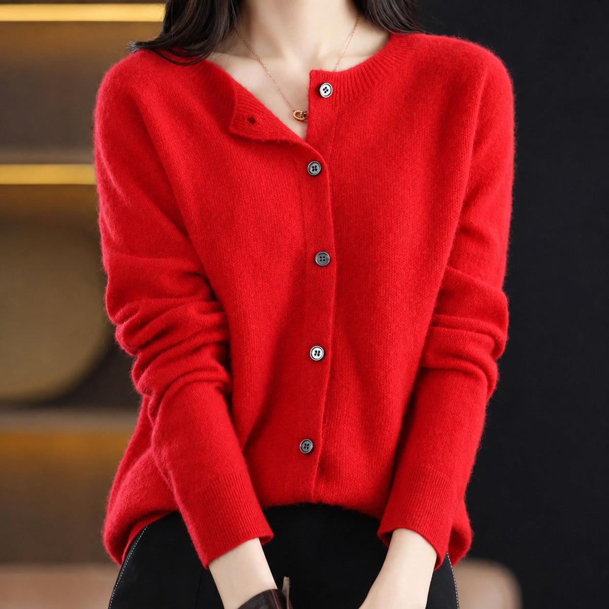 Women's plain knitted button-front cardigan with crew neckline and long sleeves