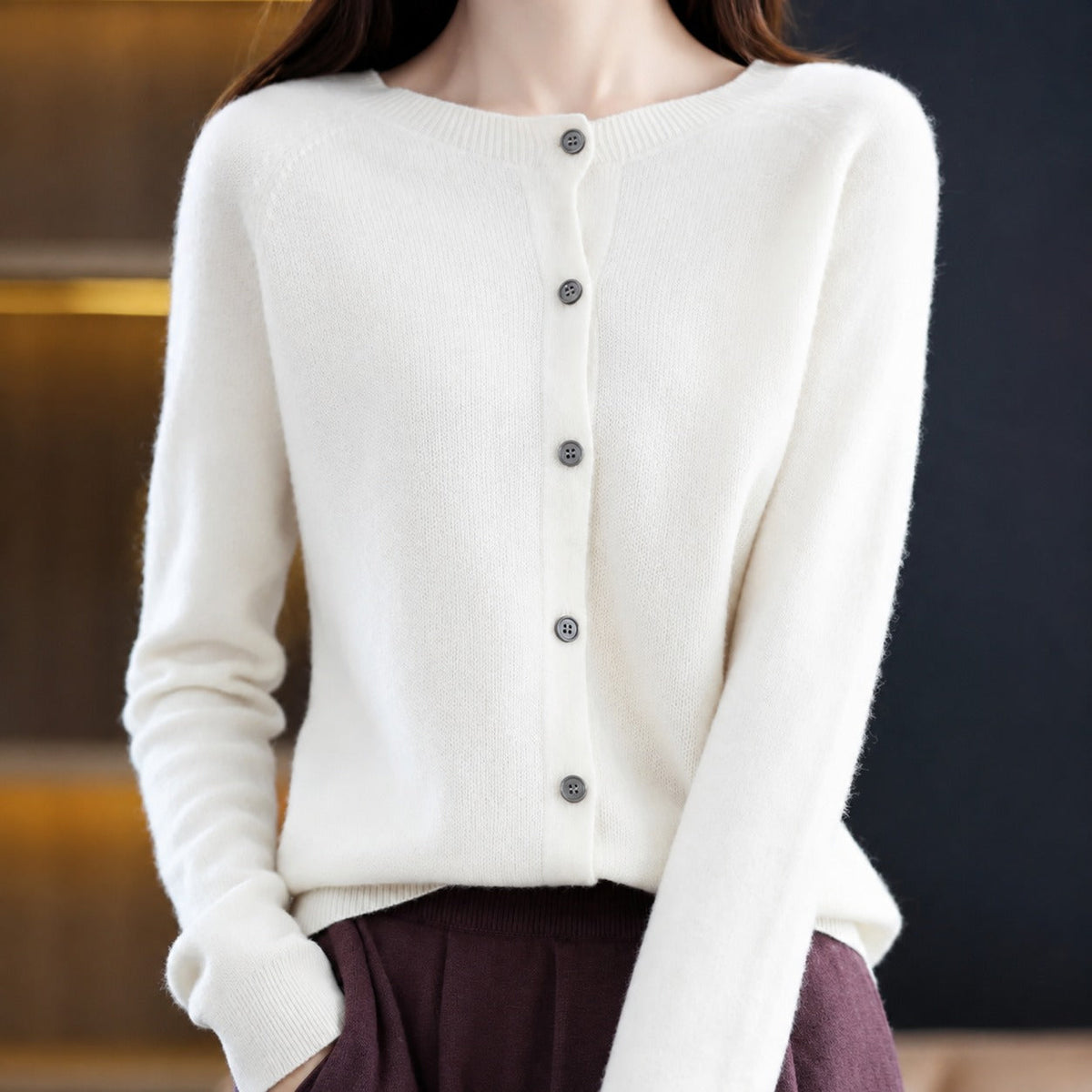 Women's plain knitted button-front cardigan with crew neckline and long sleeves