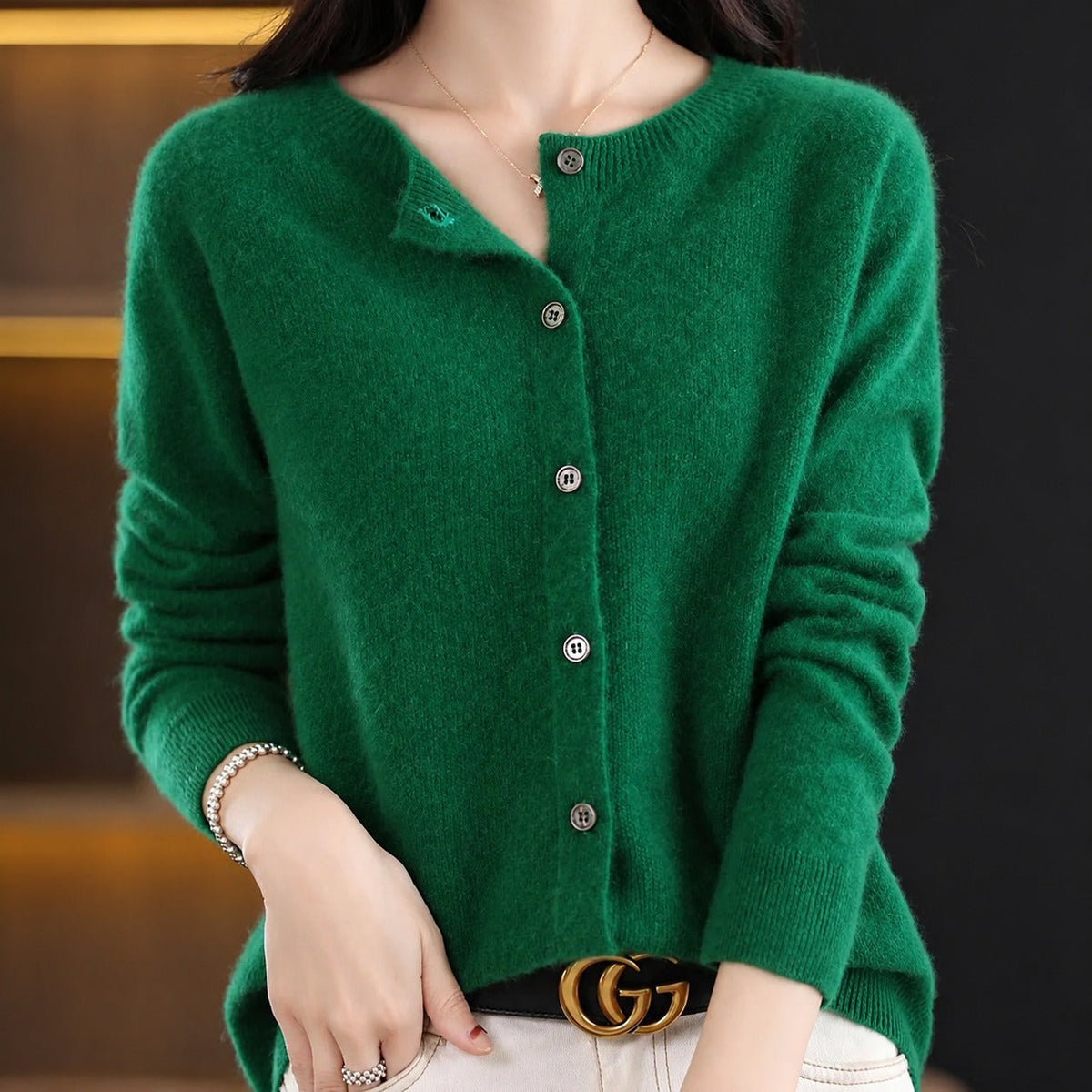 Women's plain knitted button-front cardigan with crew neckline and long sleeves