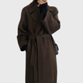 Women's long wrap coat with wide lapels and tie belt