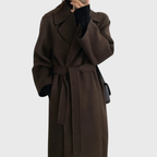 Women's long wrap coat with wide lapels and tie belt