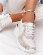 Women's lace-up wedge sneakers with perforated panels and metallic trims