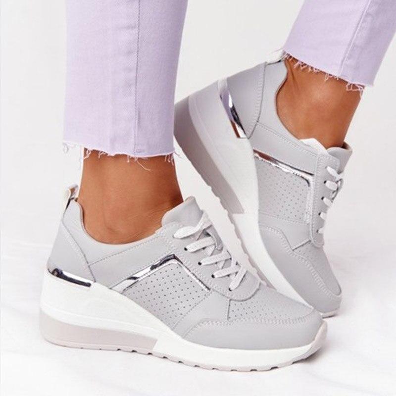 Women's lace-up wedge sneakers with perforated panels and metallic trims