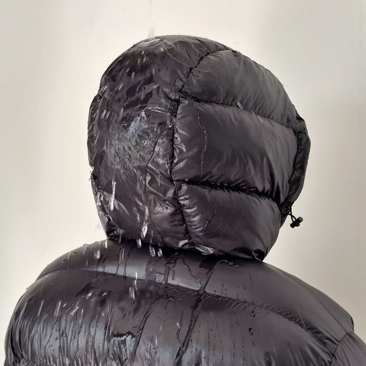 Men's hooded quilted puffer jacket shown in grey and black