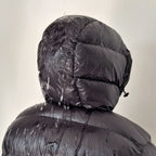 Men's hooded quilted puffer jacket shown in grey and black