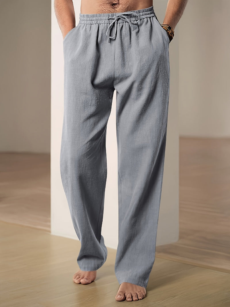 Men's plain straight-leg trousers with an elasticated drawstring waist and side pockets