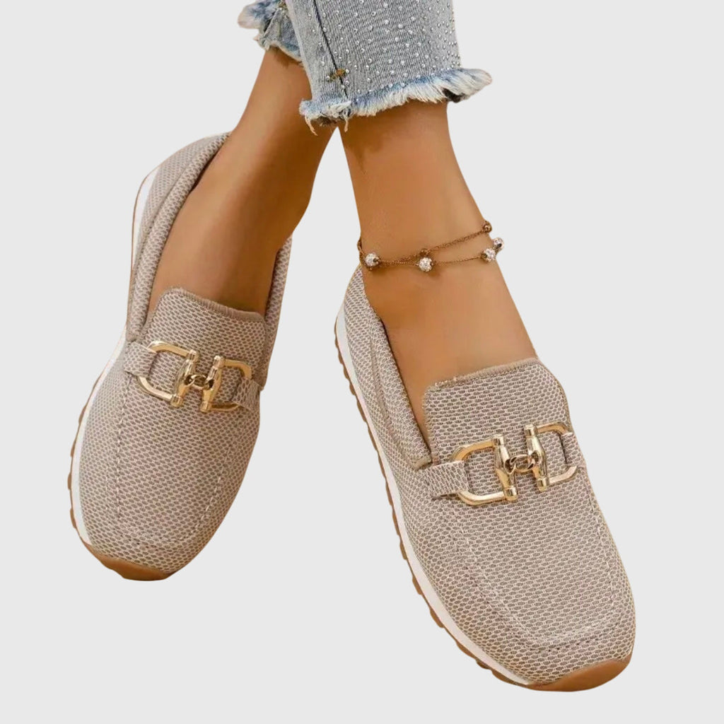 Women's textured loafers with rounded toes and front buckle details