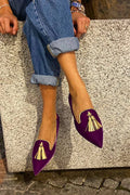 Pointed toe tassel loafers shown in purple and orange colourways