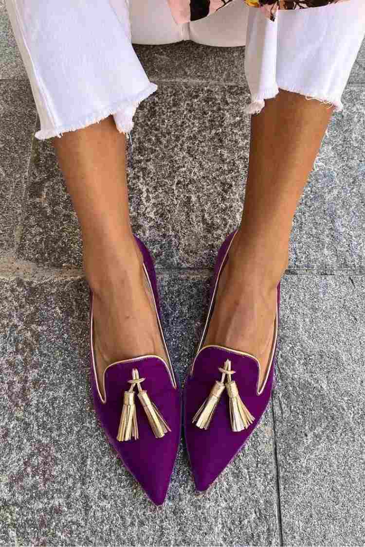 Pointed toe tassel loafers shown in purple and orange colourways