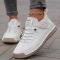 Women's ankle-height lace-up sneakers with ankle strap and flat stitched sole