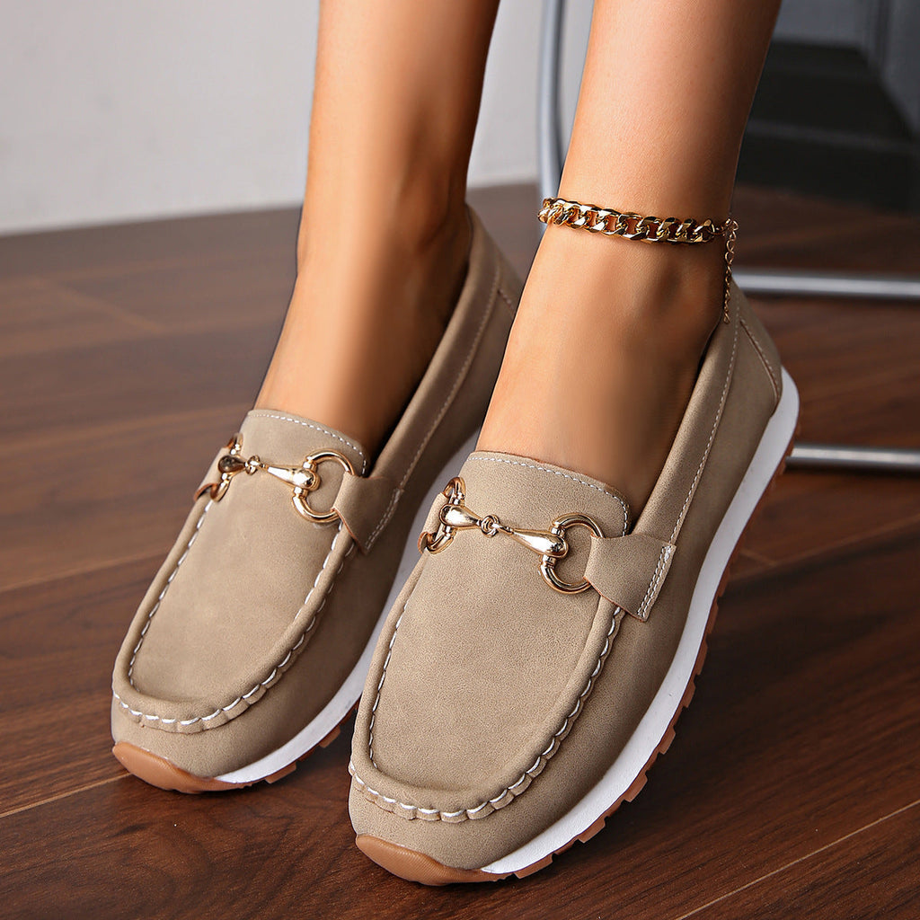 Women's flat loafers with moc toe, metal buckle trim and textured soles