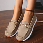 Women's flat loafers with moc toe, metal buckle trim and textured soles