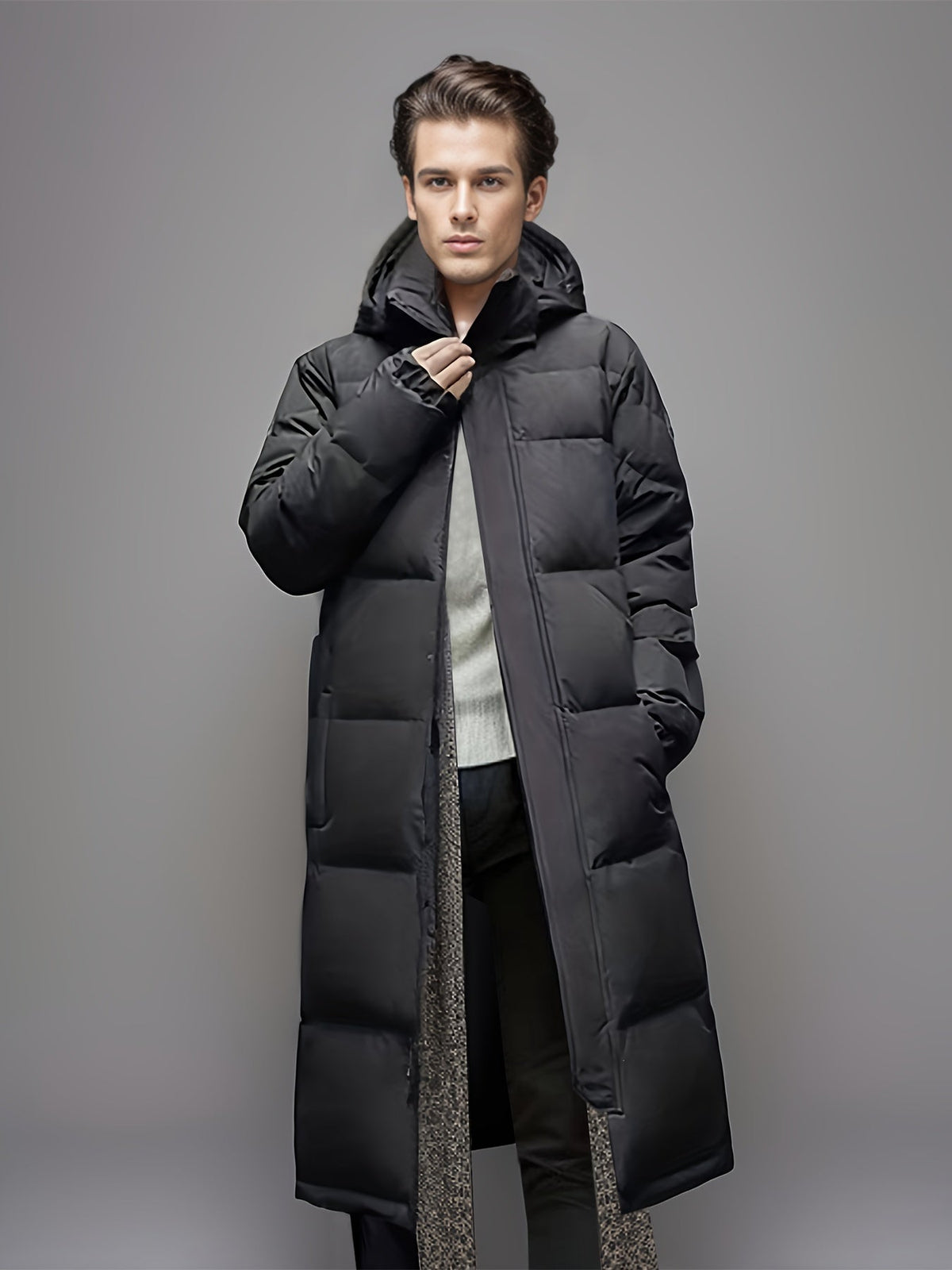 Men's black long hooded puffer coat with quilted panels and front pockets