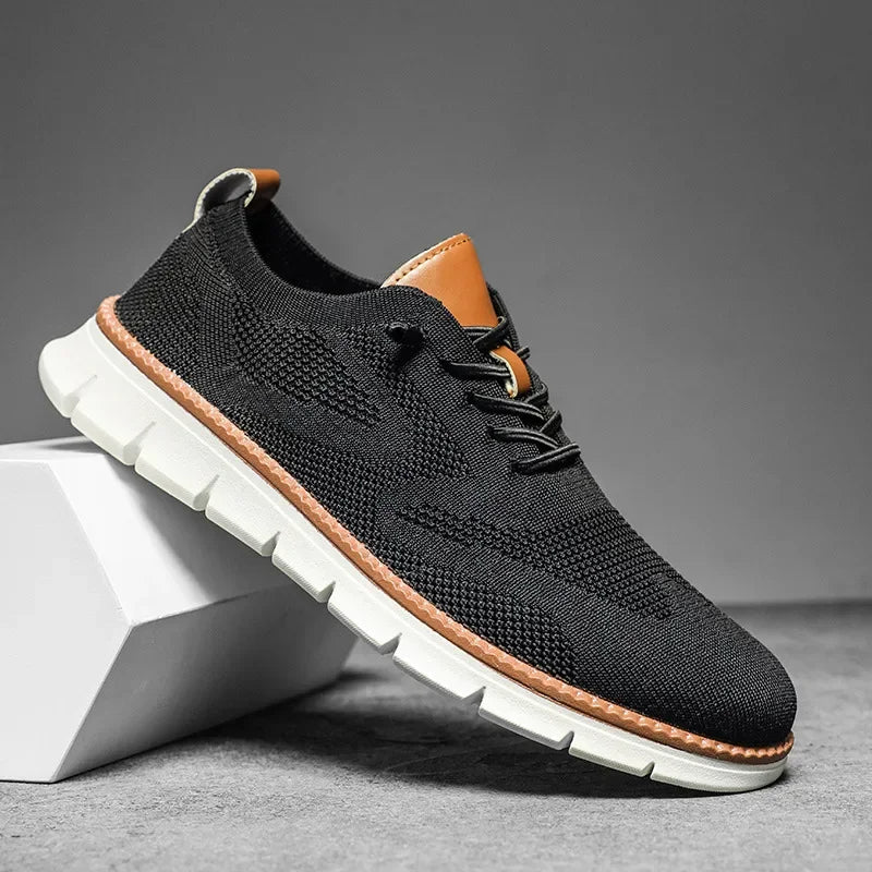 Men's low-top lace-up trainers with textured upper and white ridged sole