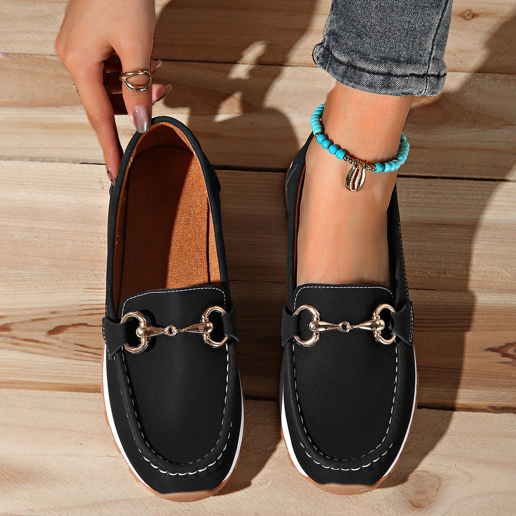 Women's flat loafers with moc toe, metal buckle trim and textured soles