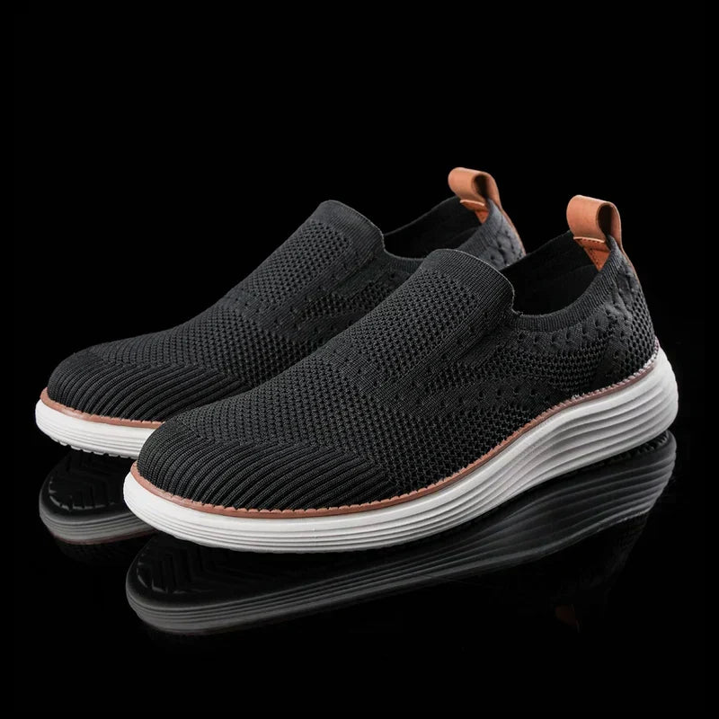 Men's textured slip-on trainers with round toes, pull tabs and layered soles