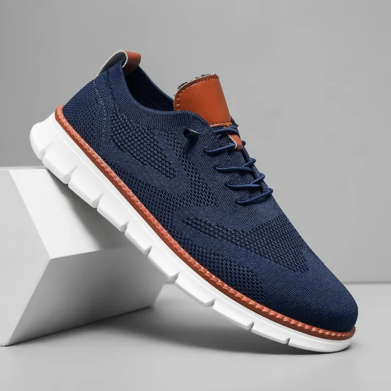 Men's low-top lace-up trainers with textured upper and white ridged sole