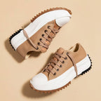 Women's platform lace-up sneakers with chunky ridged soles in beige and tiger stripe designs