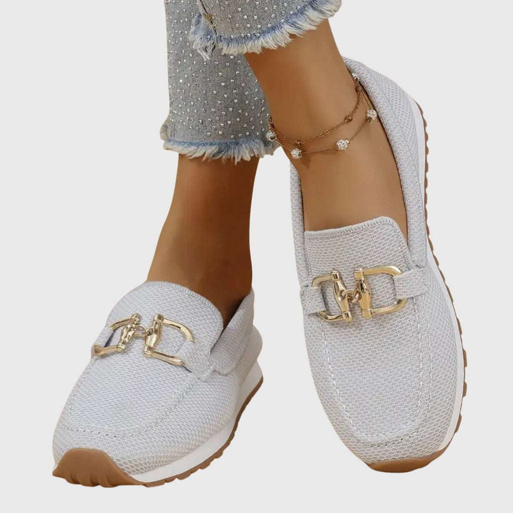 Women's textured loafers with rounded toes and front buckle details