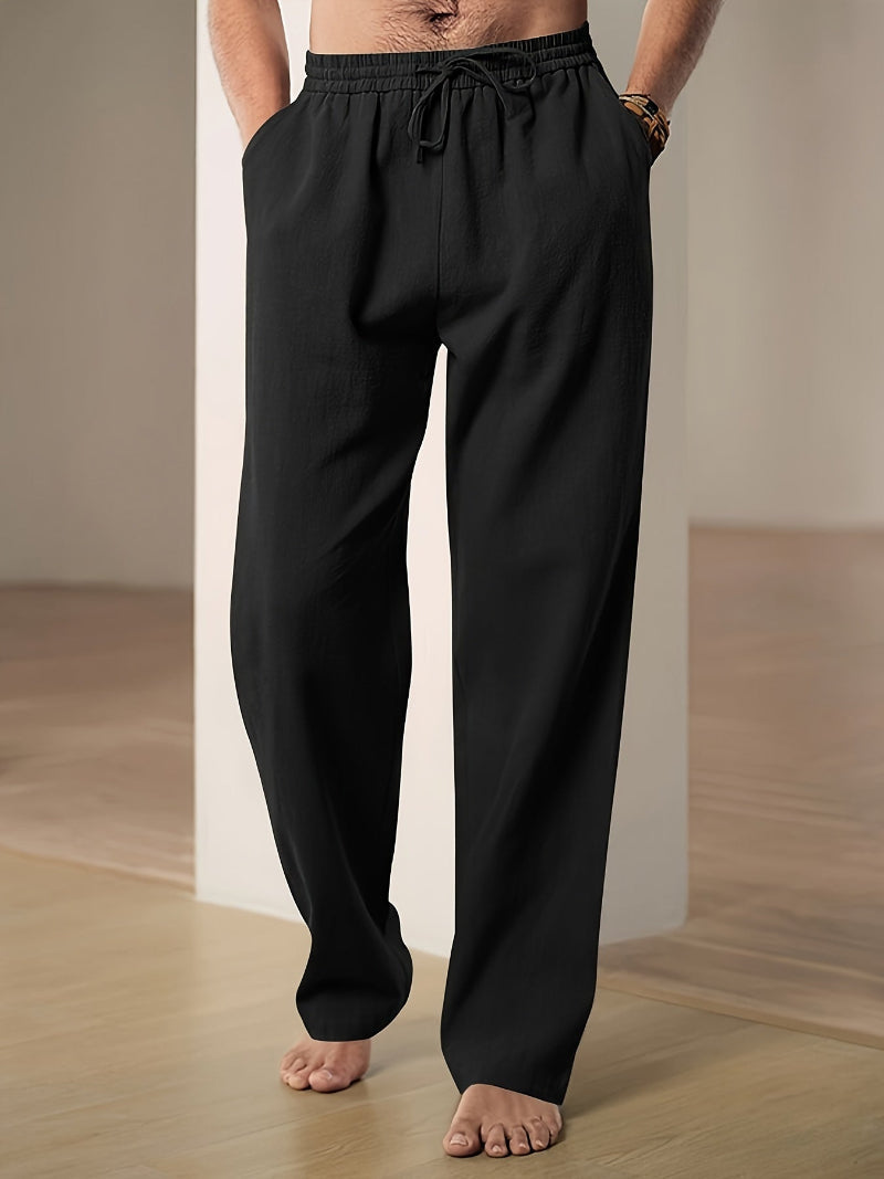 Men's plain straight-leg trousers with an elasticated drawstring waist and side pockets