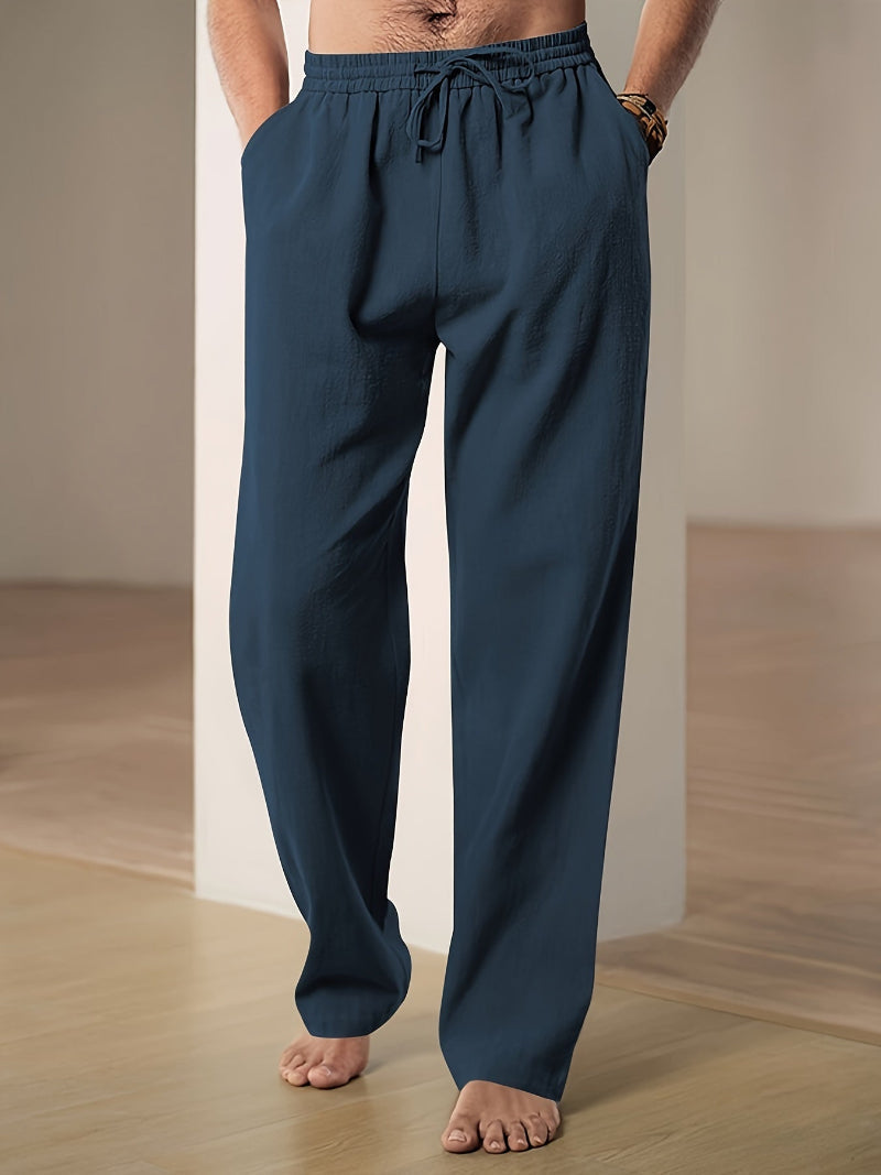 Men's plain straight-leg trousers with an elasticated drawstring waist and side pockets