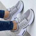 Women's low-top lace-up trainers with textured panels and chunky soles