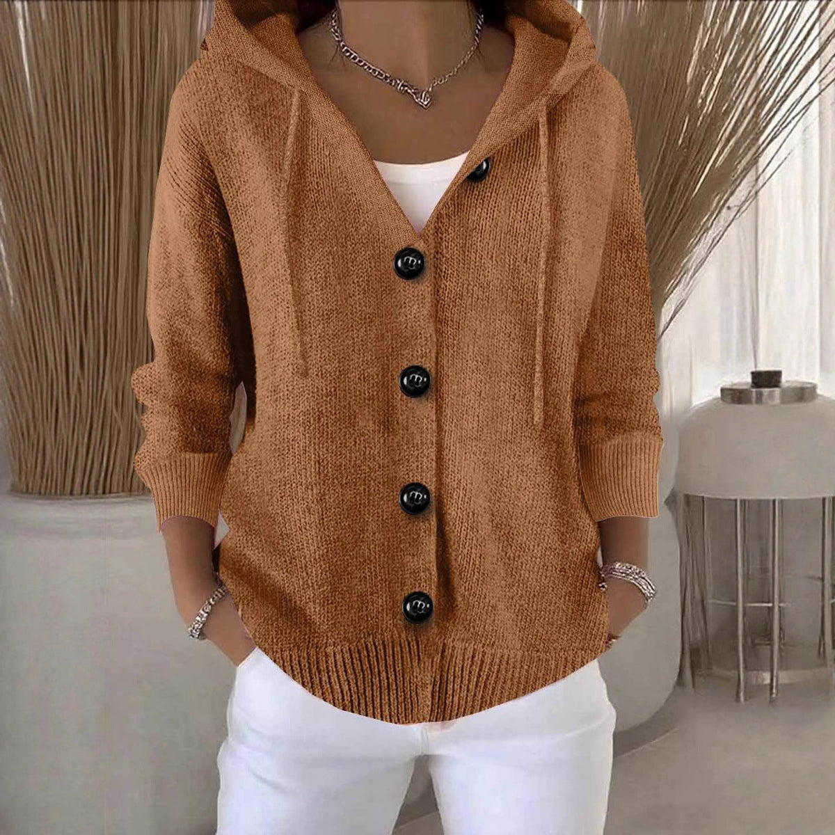Women's hooded knitted cardigan with buttons, long sleeves and front pockets