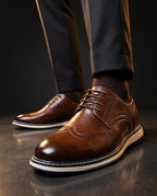 Men's wingtip brogue sneakers with perforated detailing and layered soles
