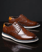 Men's wingtip brogue sneakers with perforated detailing and layered soles