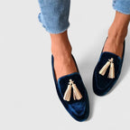 Women's dark blue almond-toe loafers with gold tassel details
