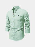 Men's long-sleeved Mandarin collar shirt with button front and curved hem
