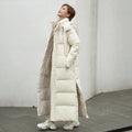 Women's long quilted puffer coat with hood and side pockets