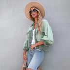 Women's cropped utility jacket with long sleeves, chest pockets and frayed trims