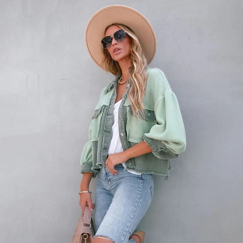 Women's cropped utility jacket with long sleeves, chest pockets and frayed trims
