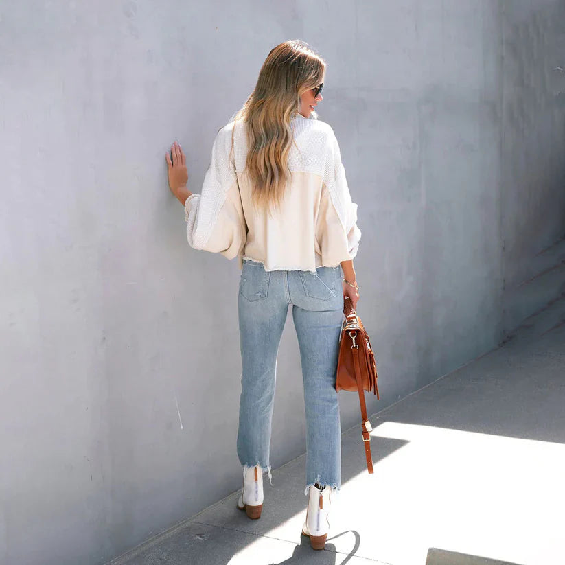 Women's cropped utility jacket with long sleeves, chest pockets and frayed trims